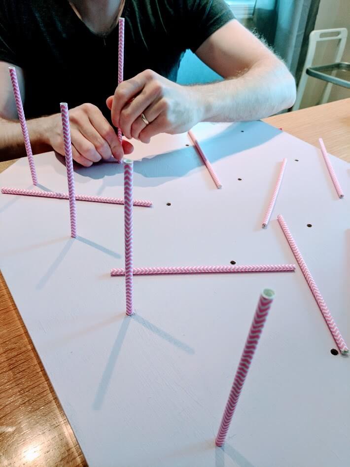 Insert straws as rods for the donut bar stand