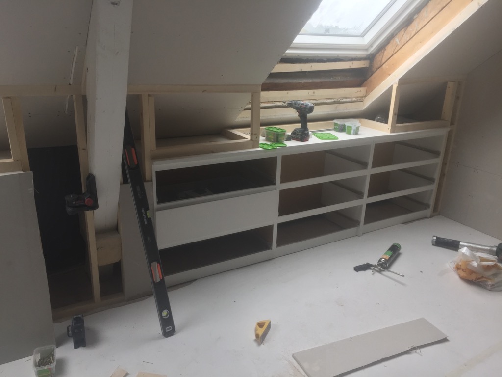Stylish loft storage with customised built-in IKEA chests