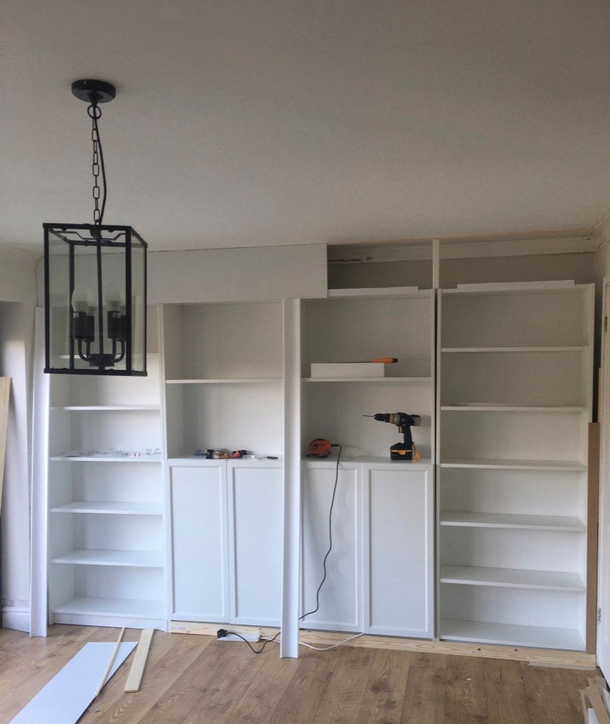 IKEA BILLY bookcase hacked into built-in living room shelves